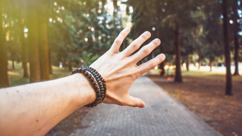 an arm full of crystal bracelets