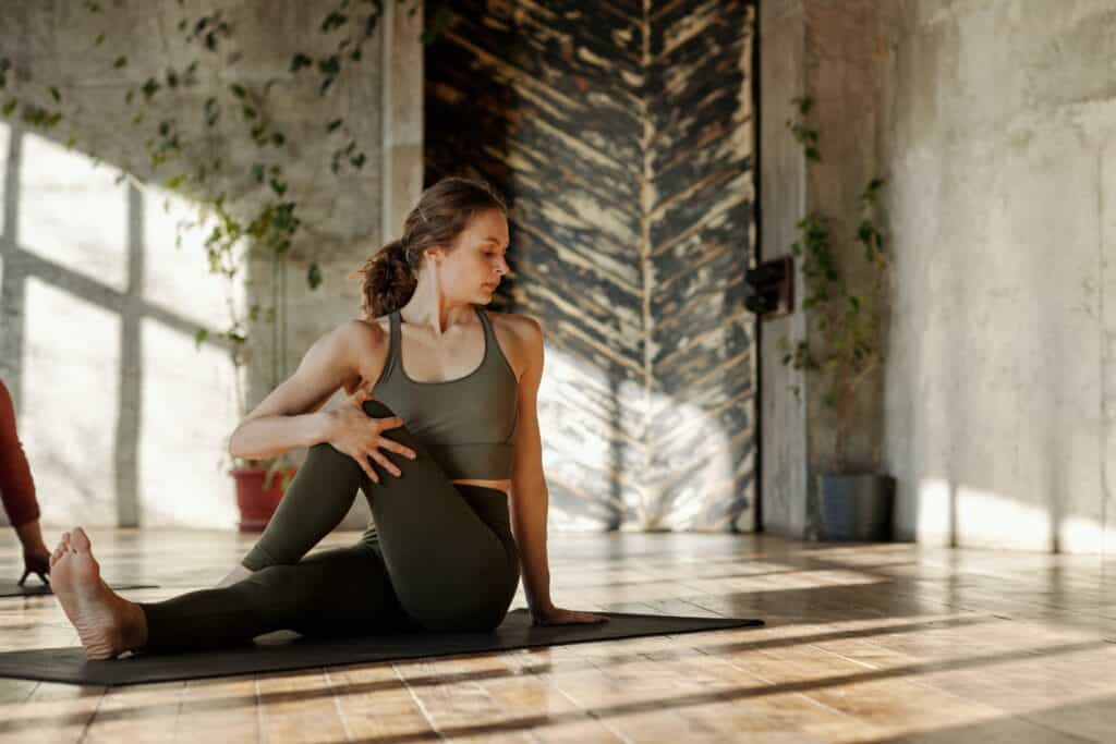 A woman wearing leggings while doing yoga