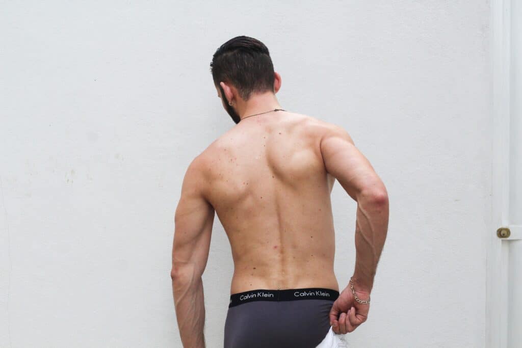 a man holding his calvin klein underwear