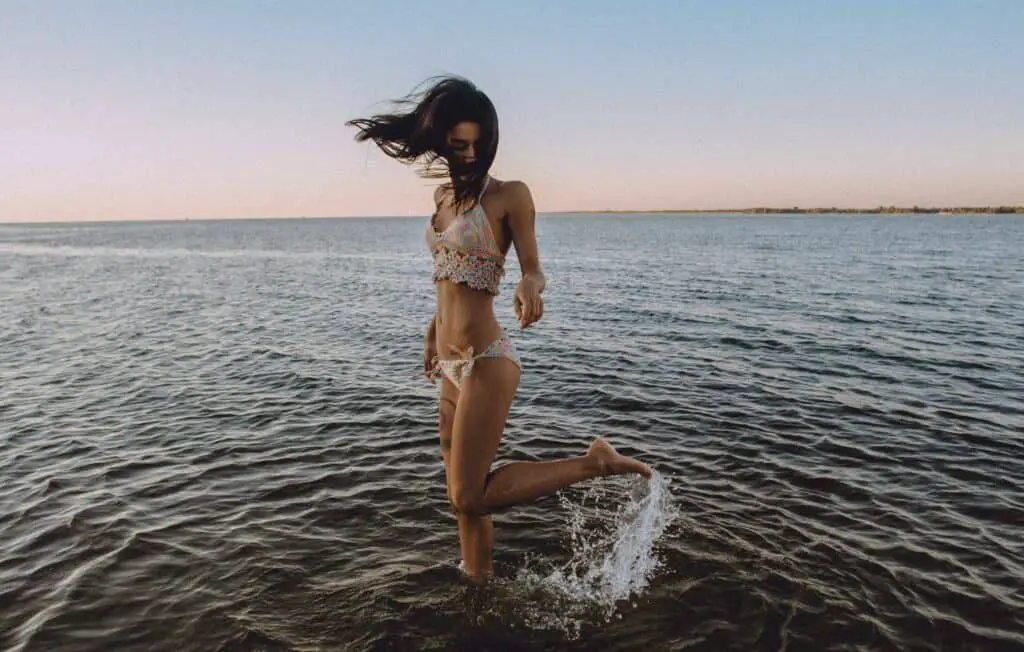 A woman in the beach wearing push up bikini