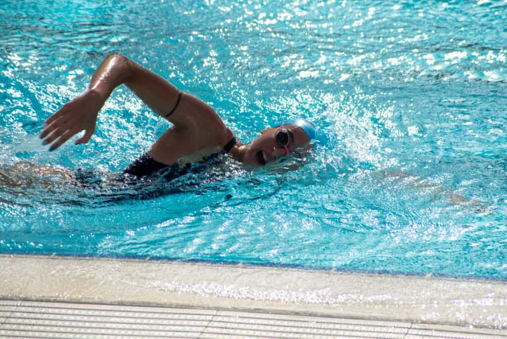 a swimmer performing sidestroke wearing a swimwear
