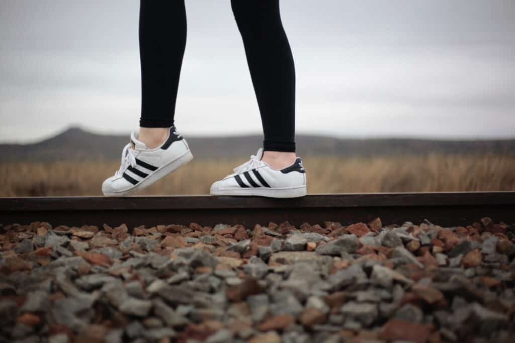 a person wearing black leggings on a field