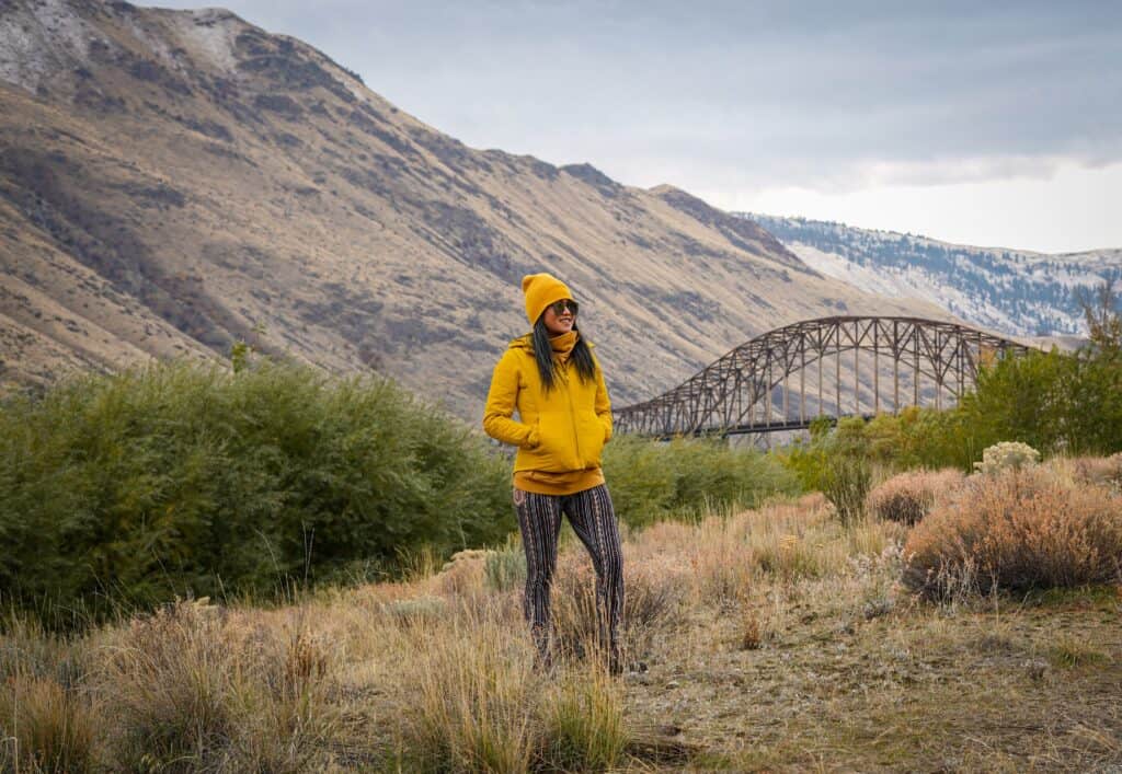 girl on the mountain wearing printed leggings