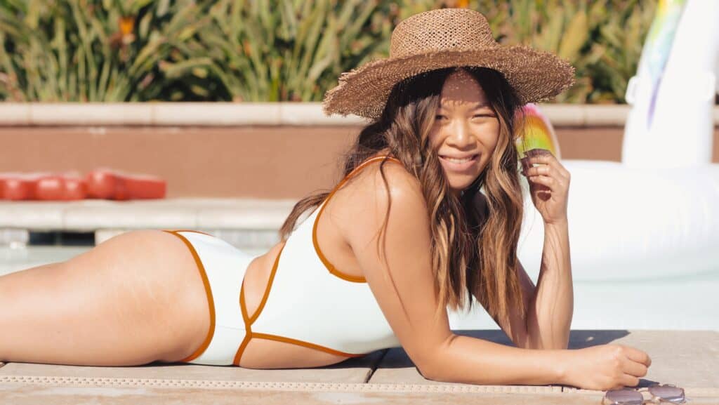 a woman wearing a trendy cut swimsuit