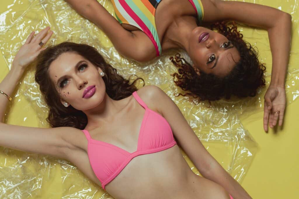 two women wearing trendy swimsuit