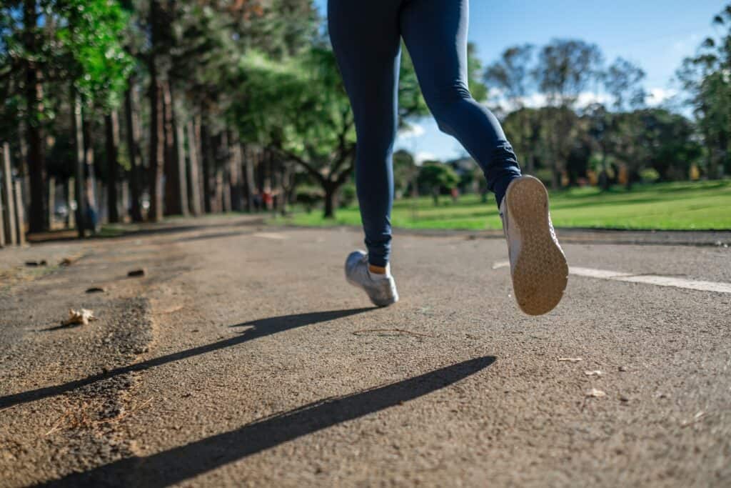 a person running wearing leggings