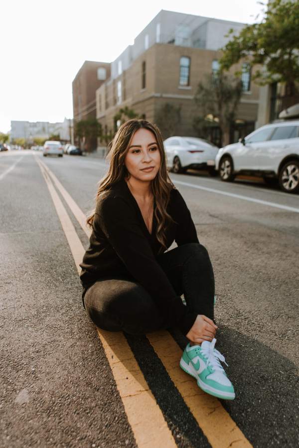 Woman wearing black lululemon leggings and cardigan