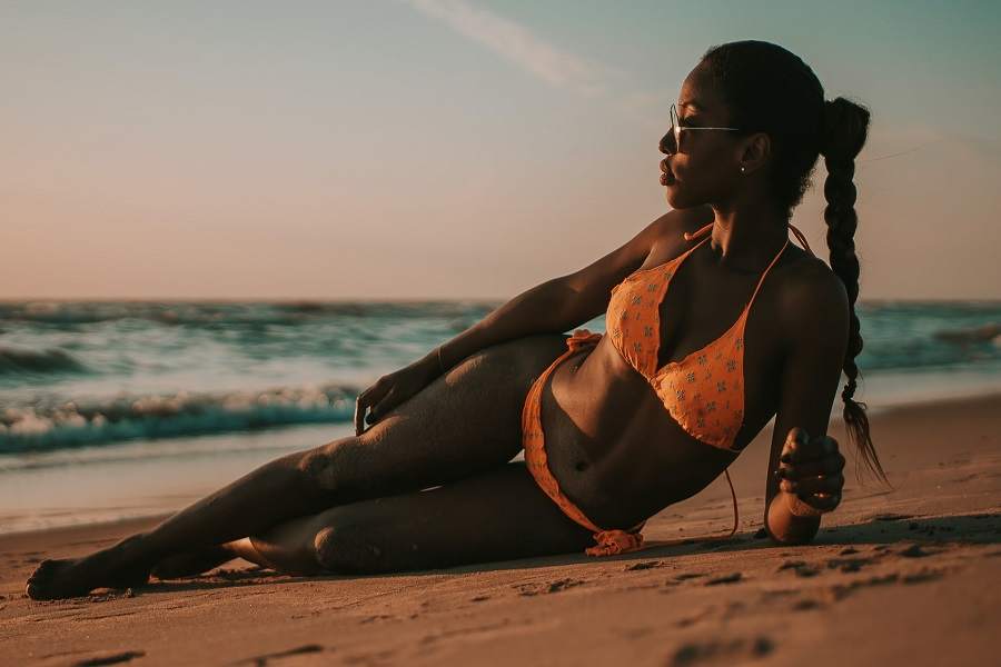 Woman wearing an orange printed bikini