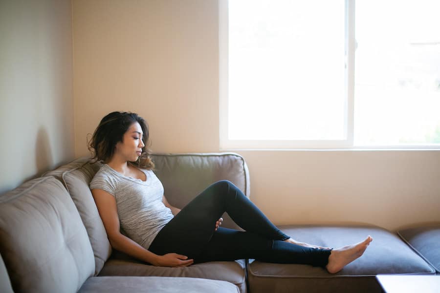 A woman wearing black leggings