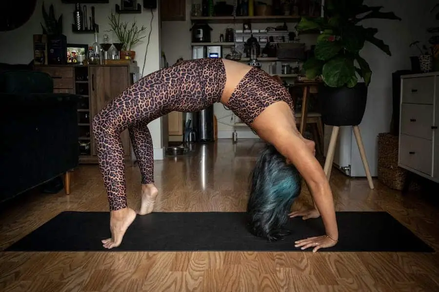 Woman on yoga mat wearing leggings