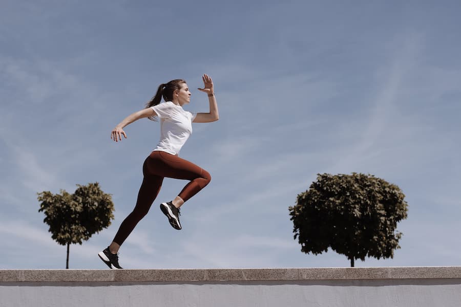 Woman running in fit leggings