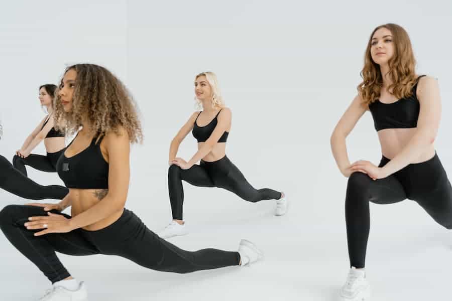 Women exercising with their black leggings