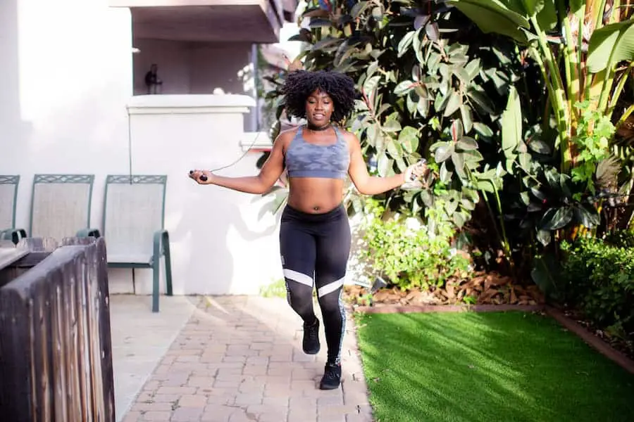 A lady doing jumping rope exercises