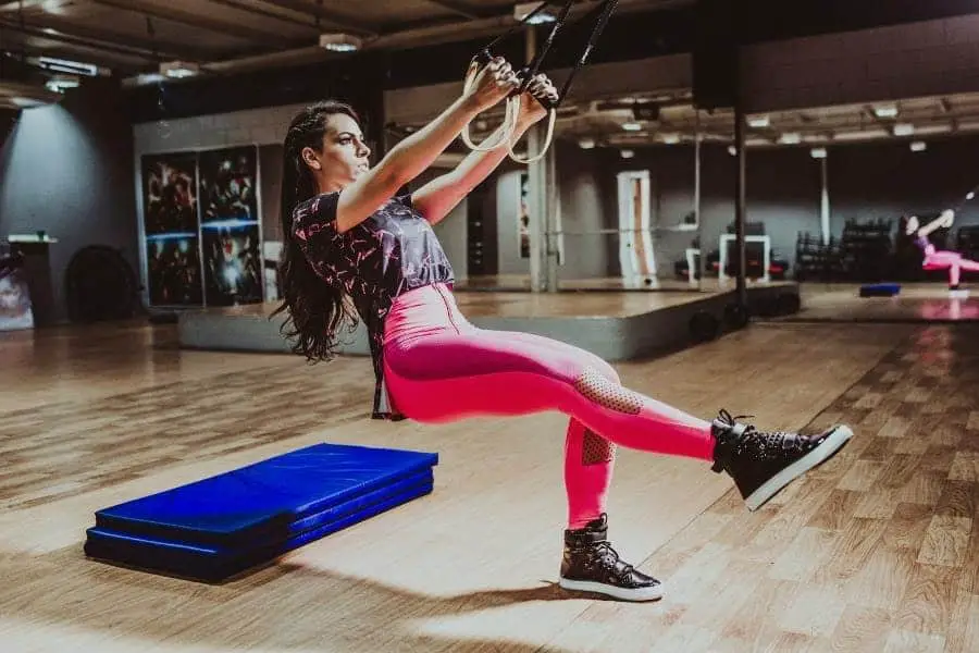 A girl working out while wearing a colorful leggings